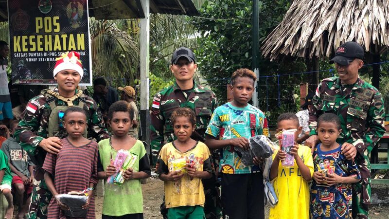 *Kecerian Bersama Masyarakat Dalam Suasana Natal, Satgas Yonif 131/BRS Adakan Perlombaan Kepada Anak-Anak di Distrik Mannem*